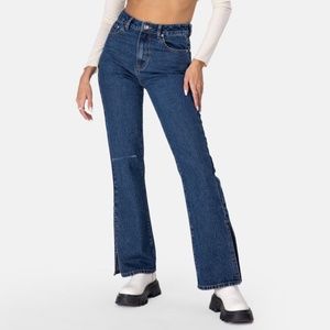 Adika high waisted dark wash flare jeans with side splits and left knee rip